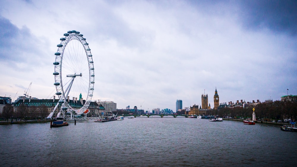 a ferris wheel by a river