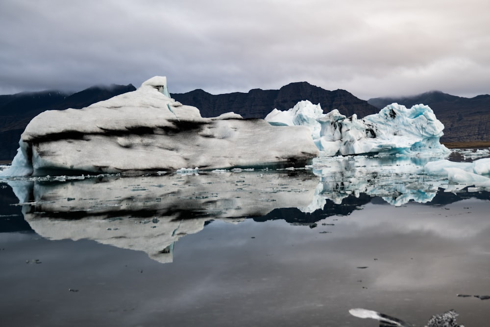 a body of water with ice and snow on it