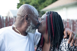 a man and woman kissing