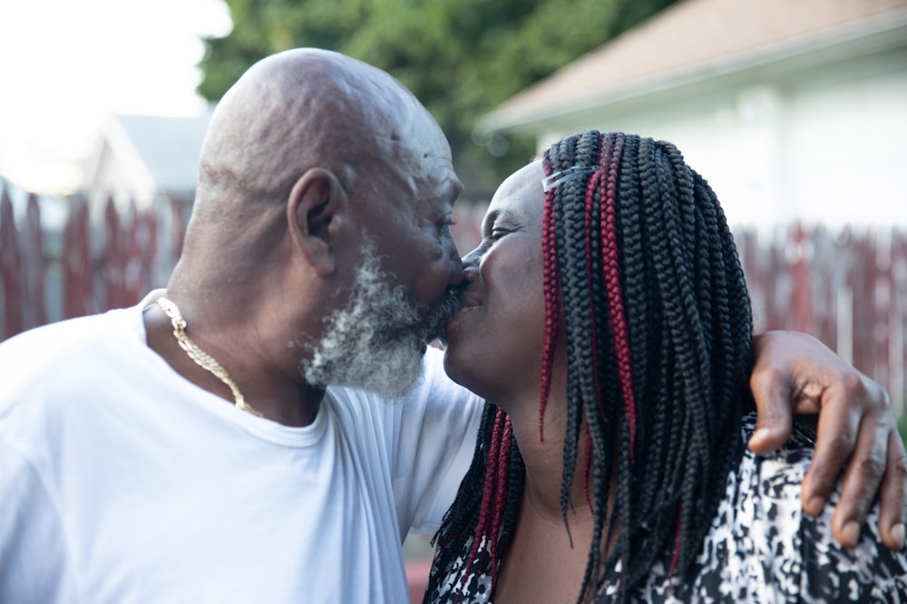 a man and woman kissing