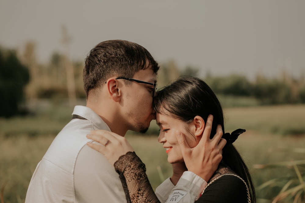 a man and woman kissing