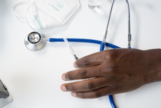 a hand holding a syringe