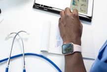 a hand holding a smart watch