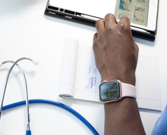 a hand holding a smart watch