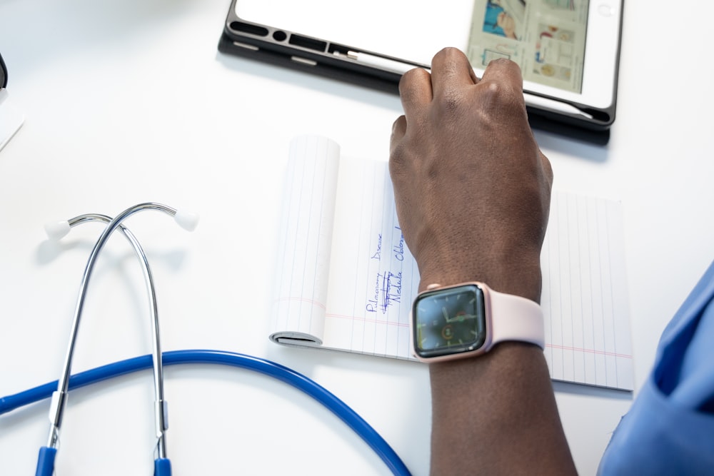 a hand holding a smart watch