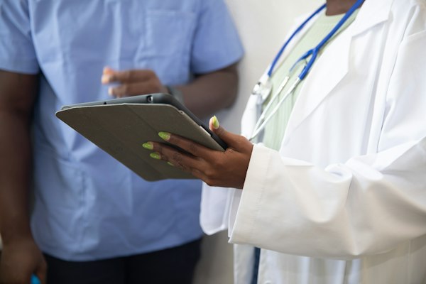 Doctor showing a patient their results on a tablet