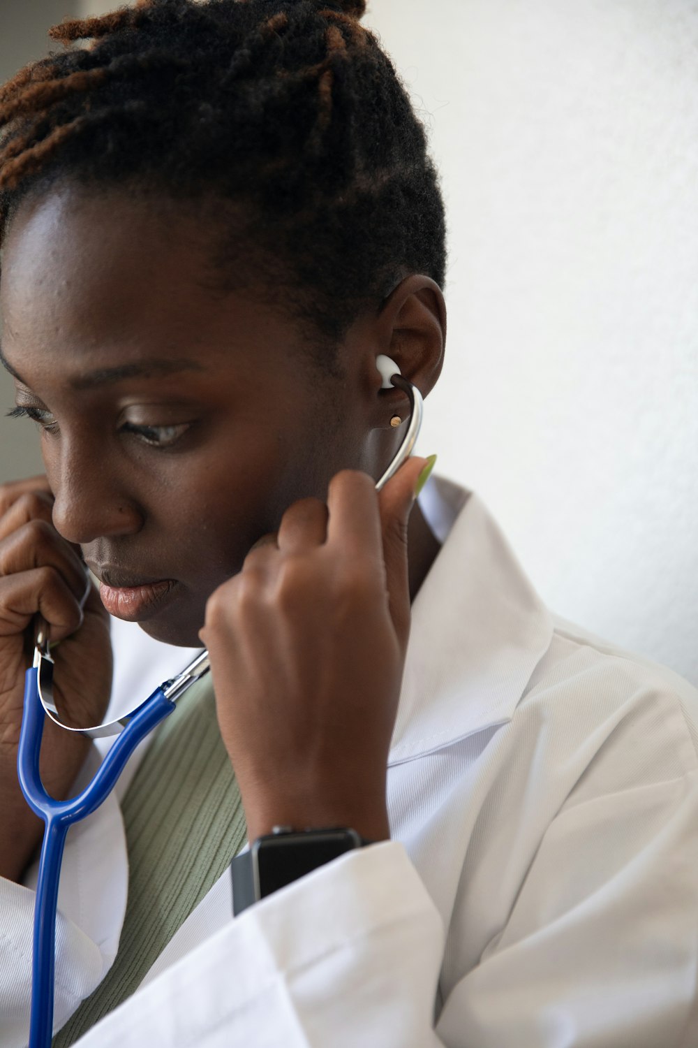 a doctor with a stethoscope around his neck