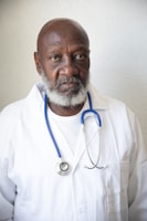 a man wearing a white lab coat