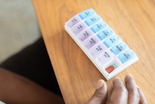 a hand holding a stack of paper money