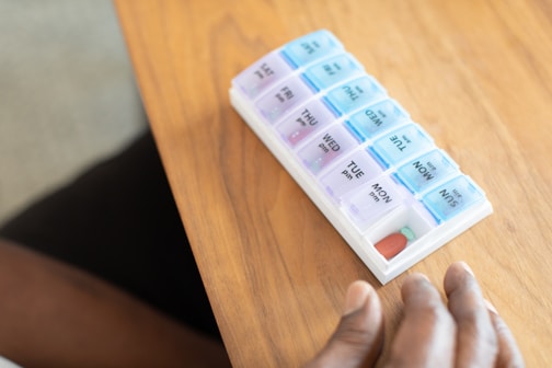 a hand holding a stack of paper money