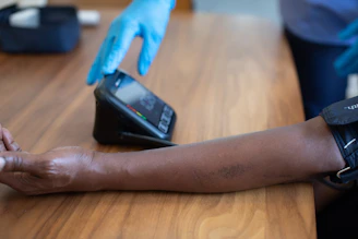 a hand holding a smart watch
