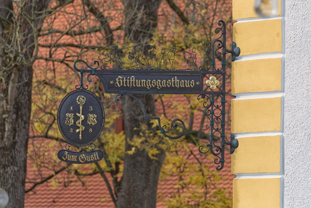 a clock on a tree, Gut Freiham Biergarten