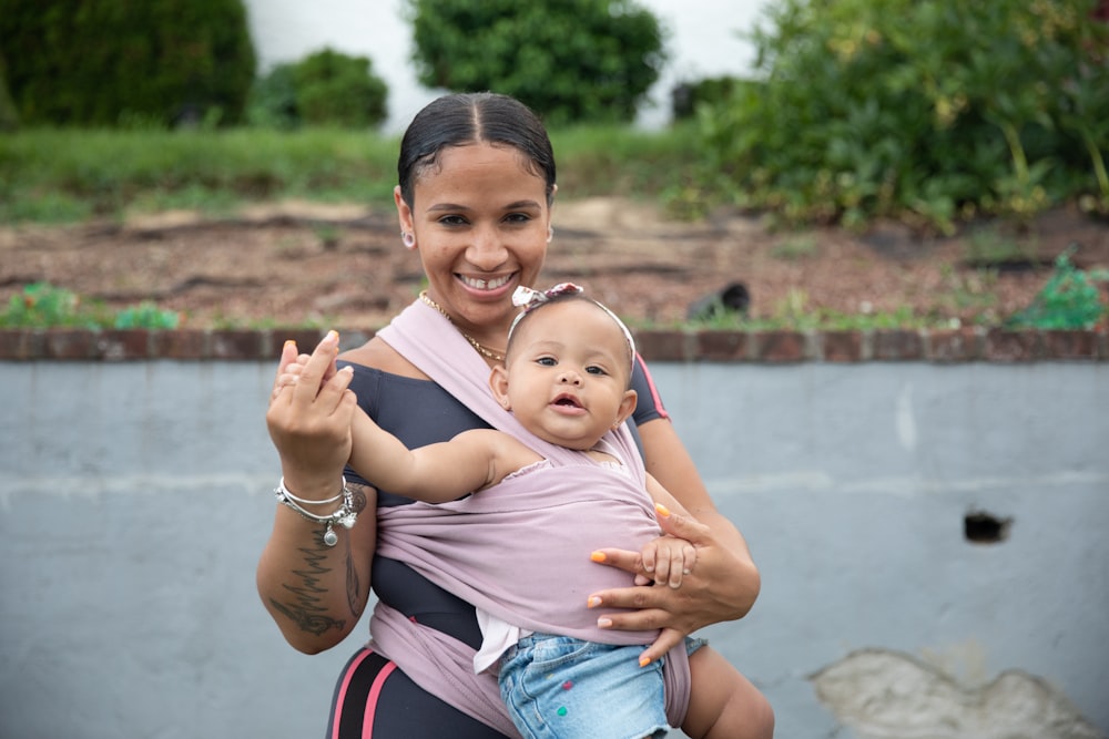 a person holding a baby