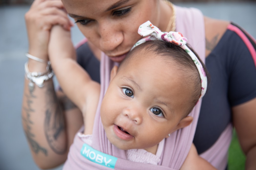 a person holding a baby