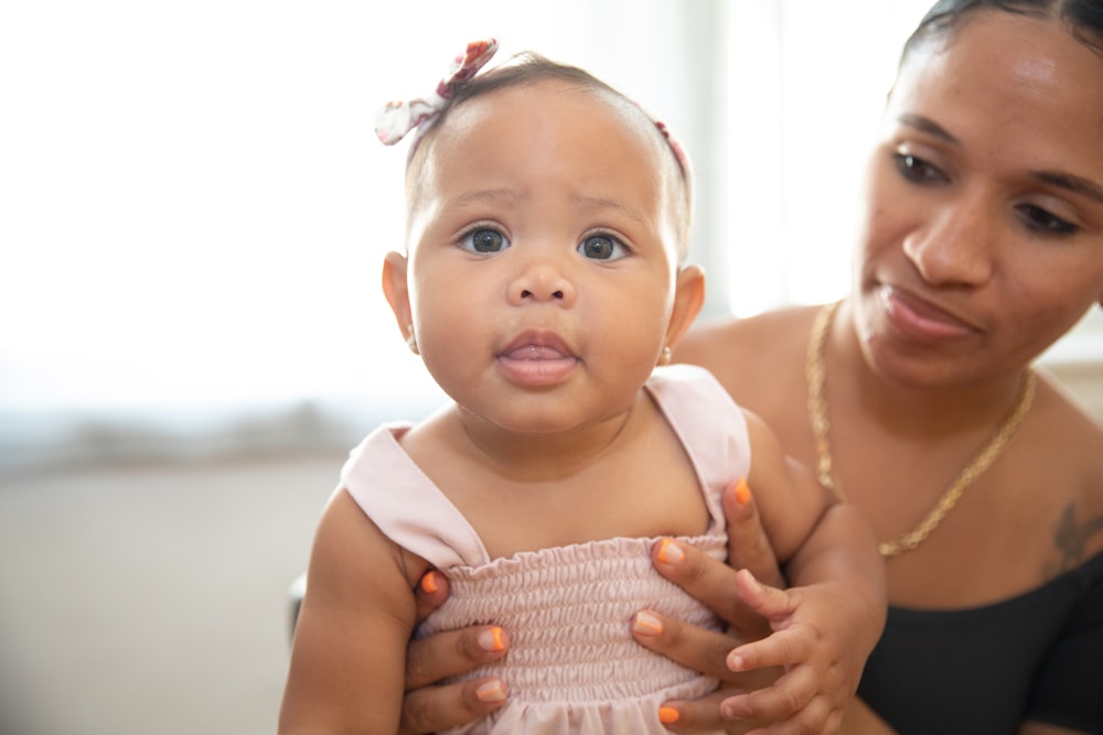 a person holding a baby