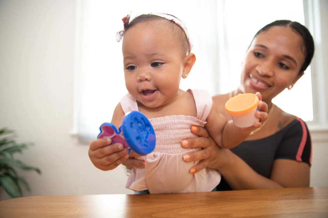 Toddler engaged in a creative hands-on activity at home
