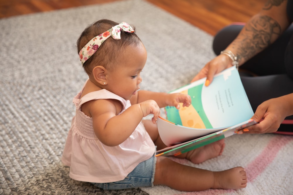 a baby reading a book