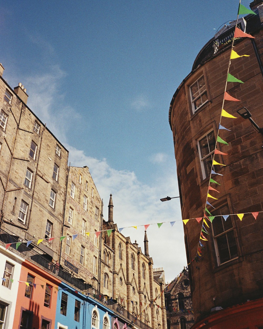 a row of buildings with flags