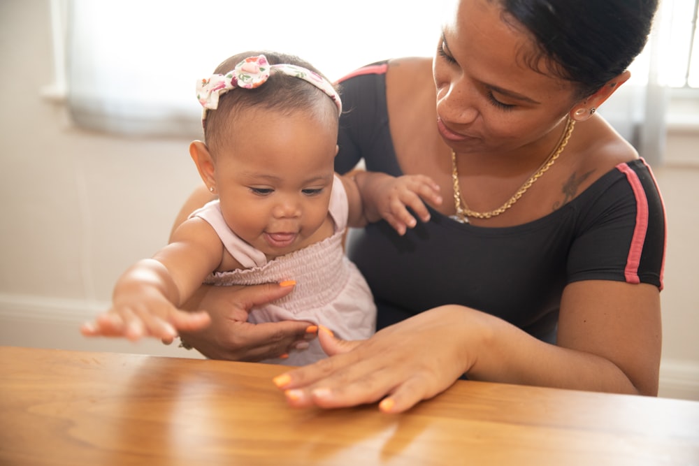 a person holding a baby