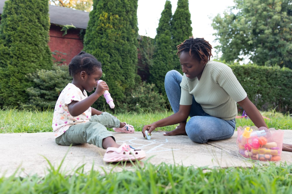 a person and a child playing with a toy