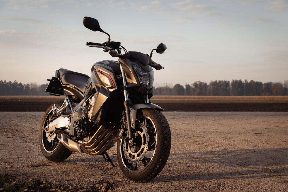 a motorcycle parked on a dirt road