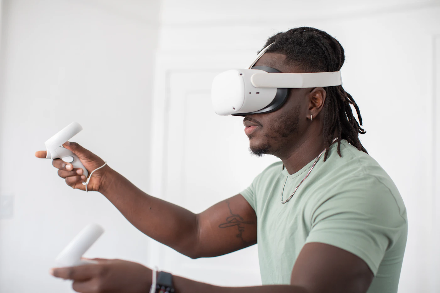 Person using a virtual reality headset and handheld controllers