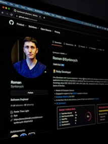 A digital profile screen viewed on a web browser, showcasing a user's account on a platform. The profile includes a photo of a person, details about their job as a Software Engineer, and professional achievements. There is also a description of their developer skills and project experiences. The GitHub interface shows navigation tabs along the top and profile details in the main content area.