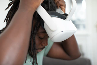 Close-up of hands adjusting VR headset straps before a session.
