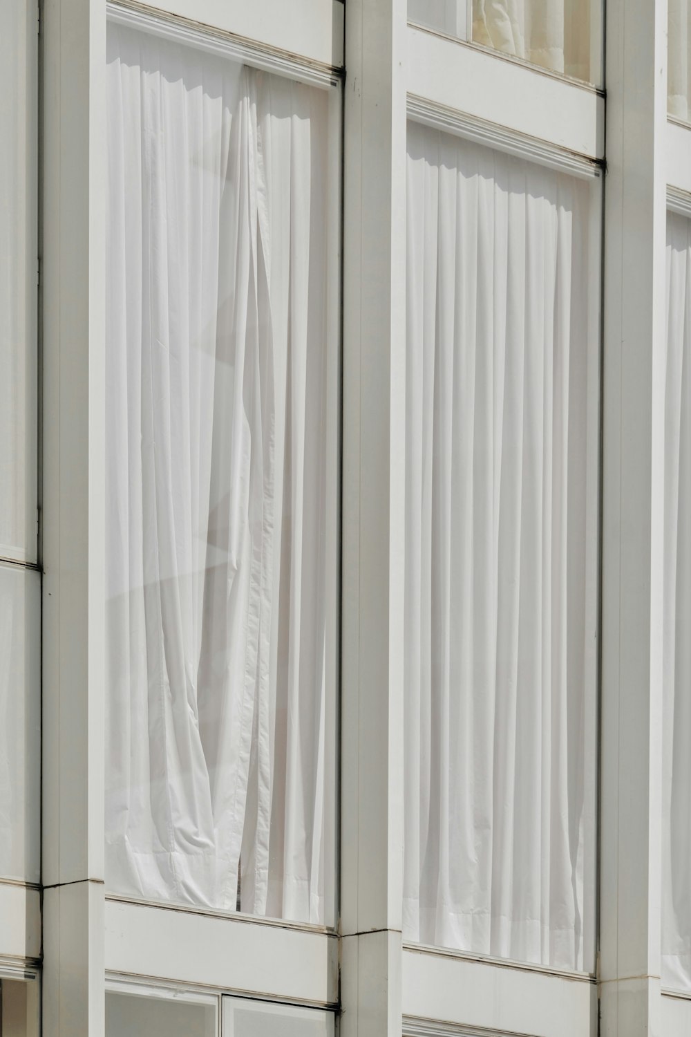 a white curtain with a window