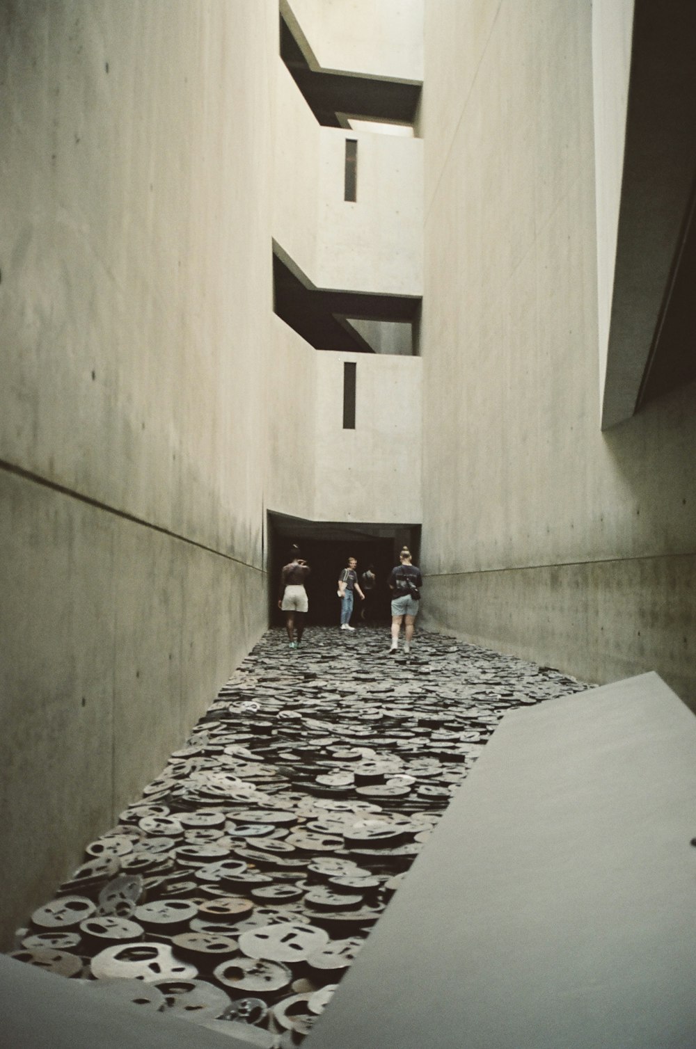 a group of people standing in a hallway