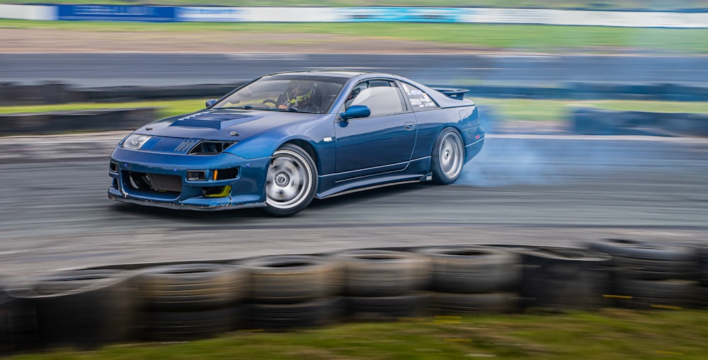 a blue car on a race track