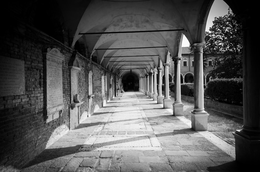 a stone walkway with pillars