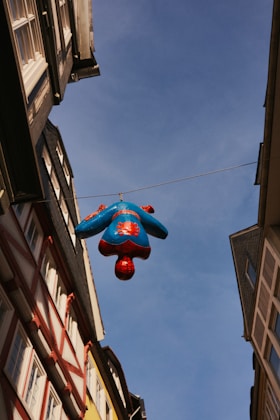 a blue balloon from a building