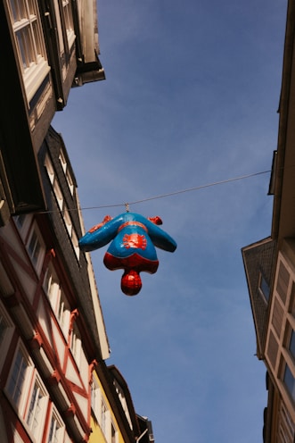a blue balloon from a building