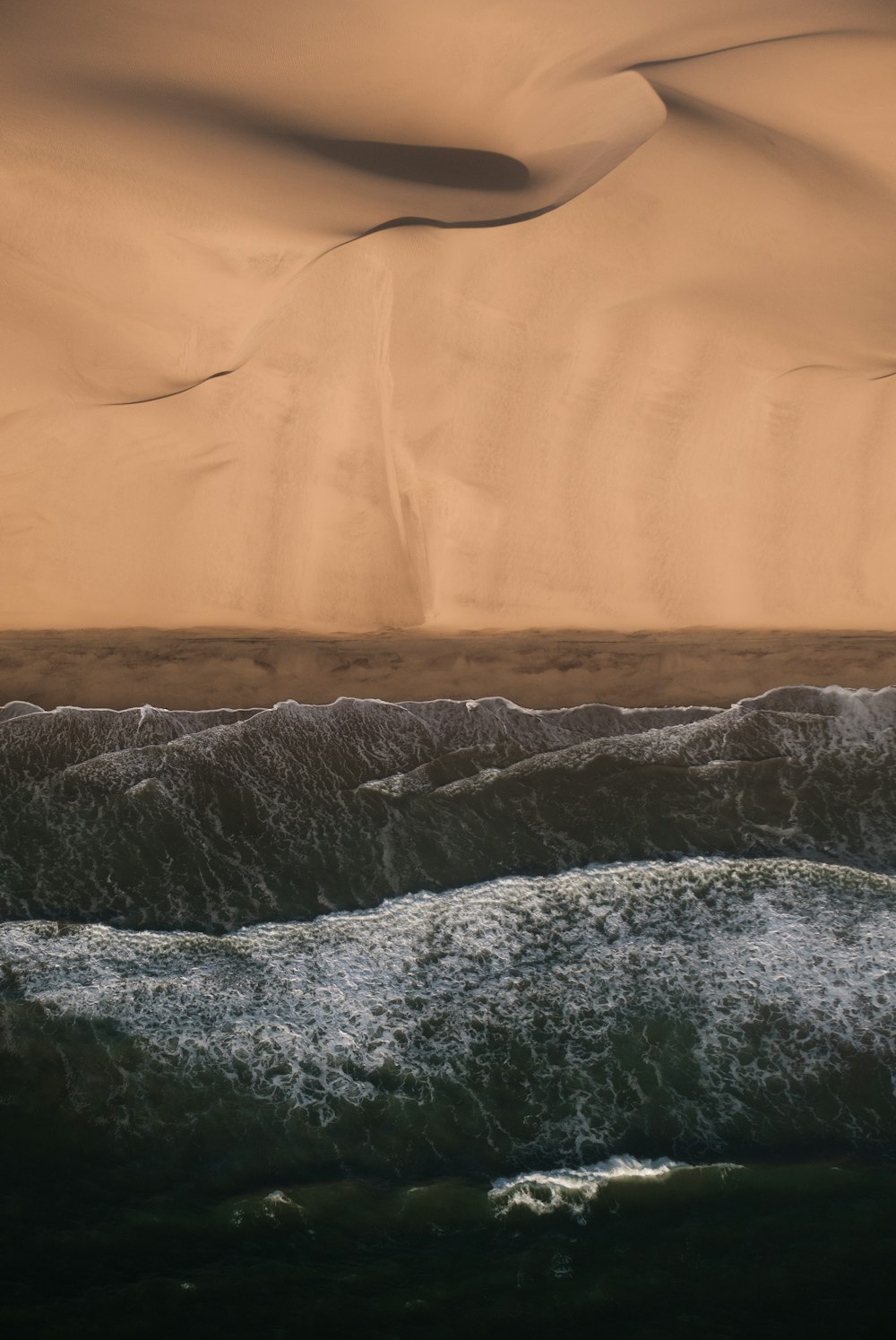 a wave crashing on a beach