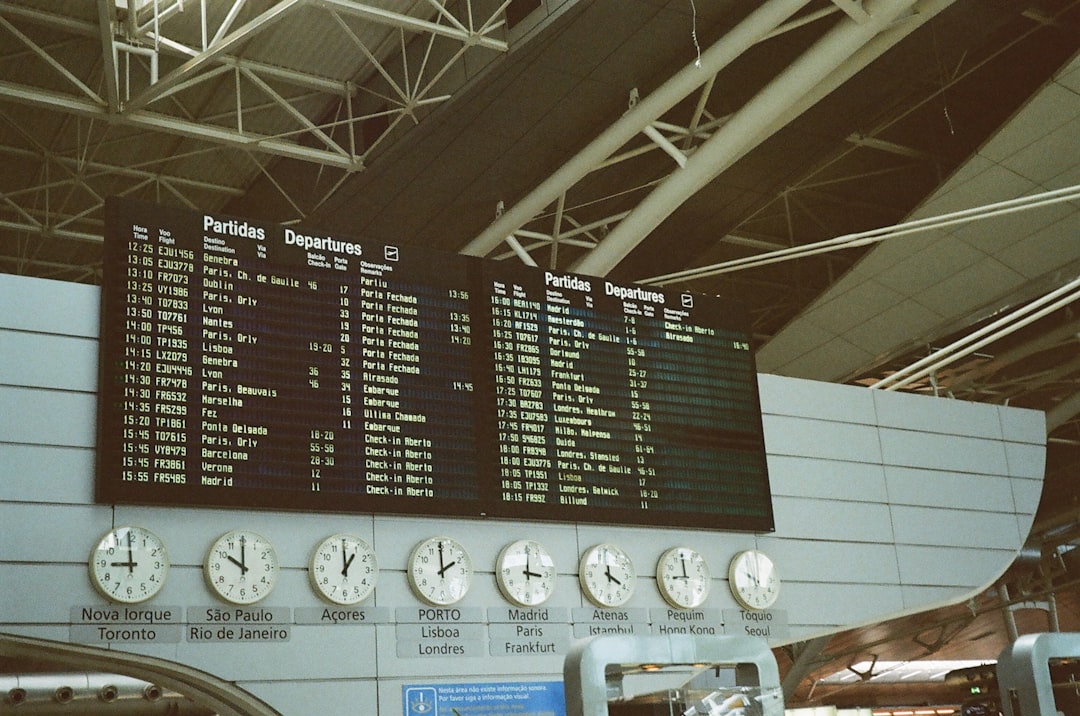 a sign with a number of clocks,