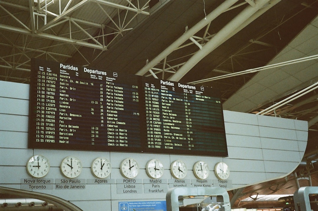 a sign with a number of clocks,