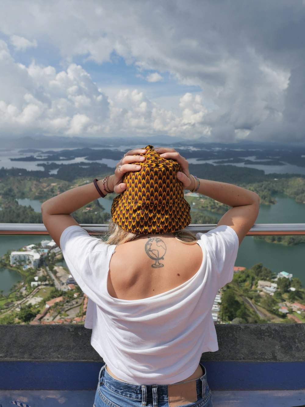 a woman holding a pineapple