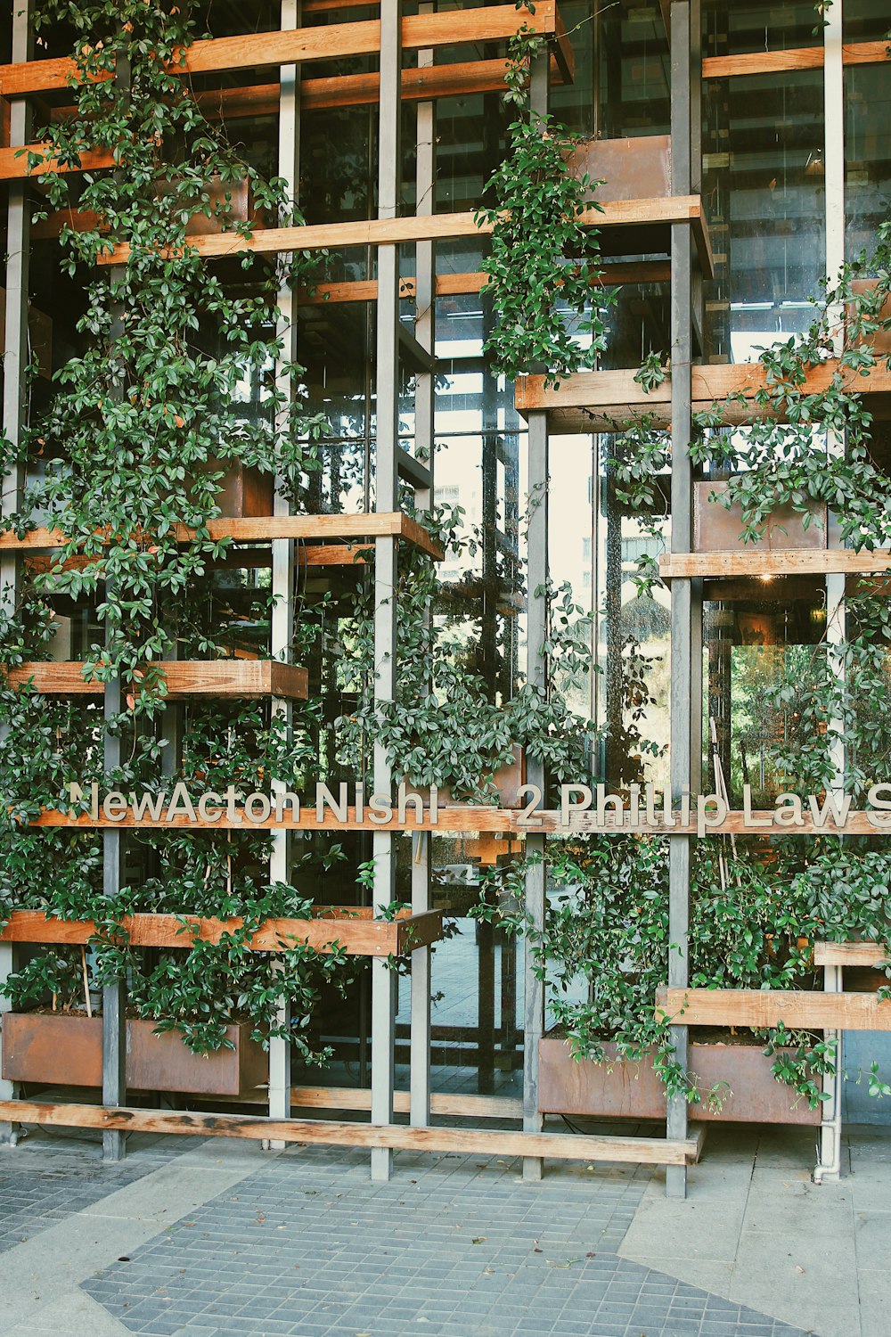 a building with plants growing on the roof