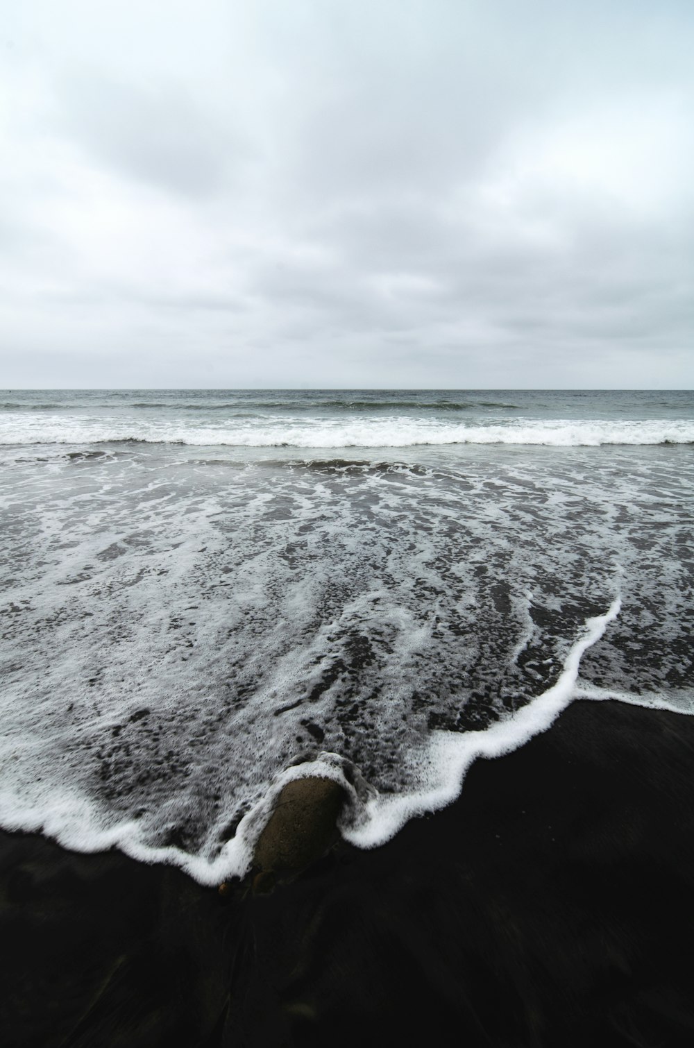 a beach with waves crashing