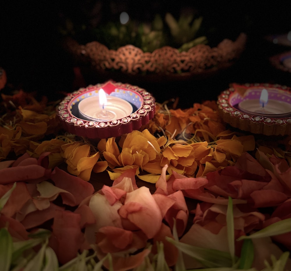 a candle in a bouquet of flowers