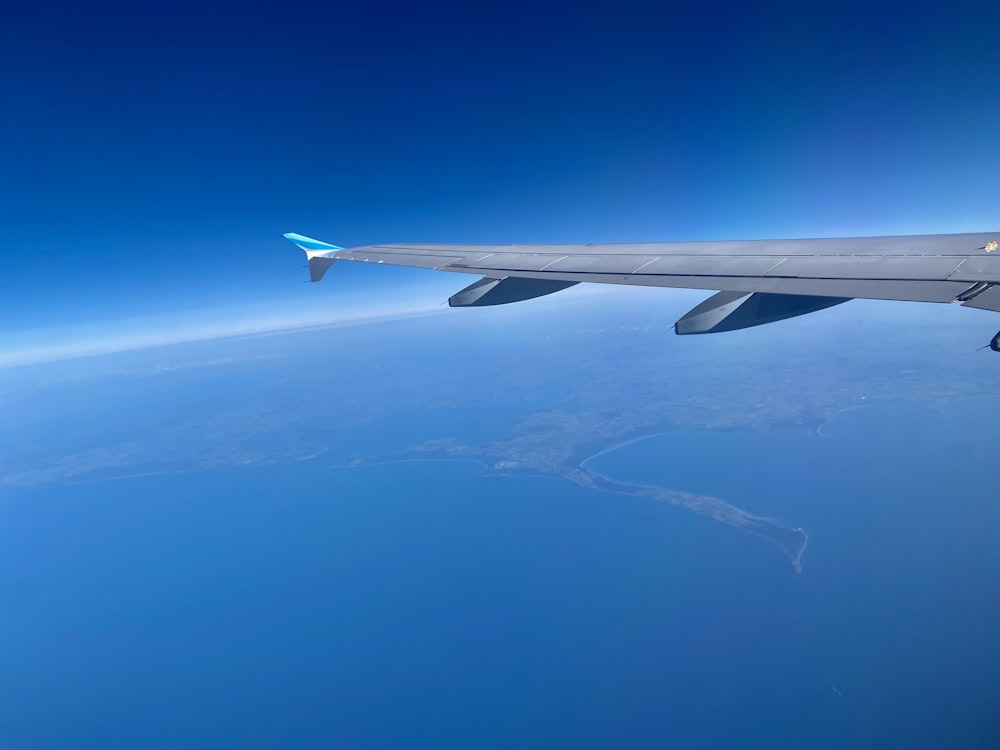 an airplane flying over the ocean
