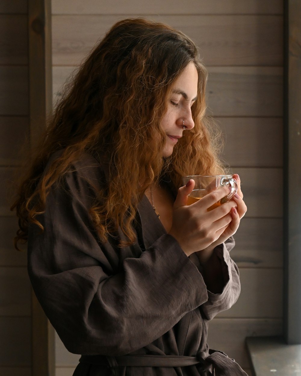 a woman holding a glass