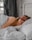 a woman lying in a bed