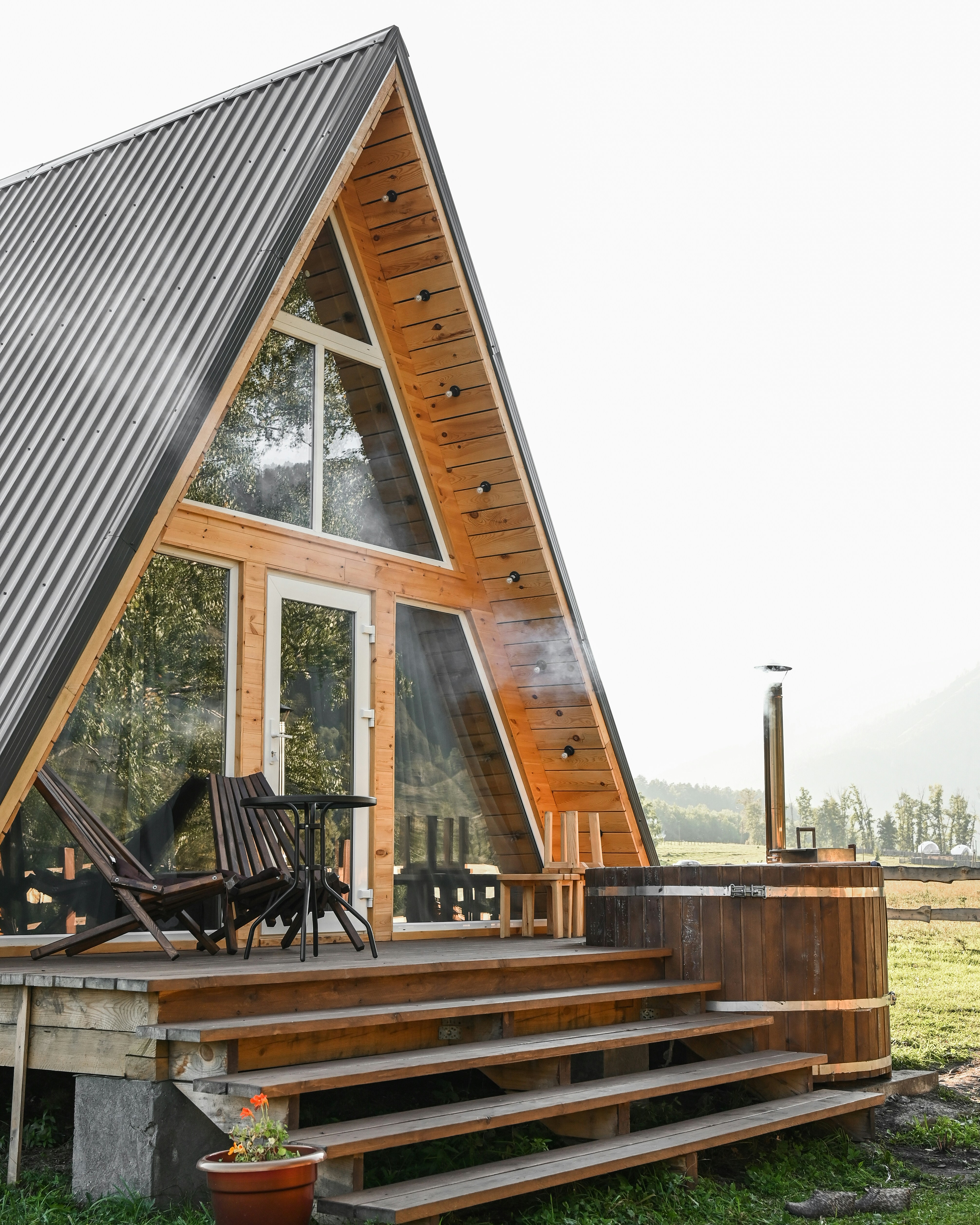 a wooden house with a glass front