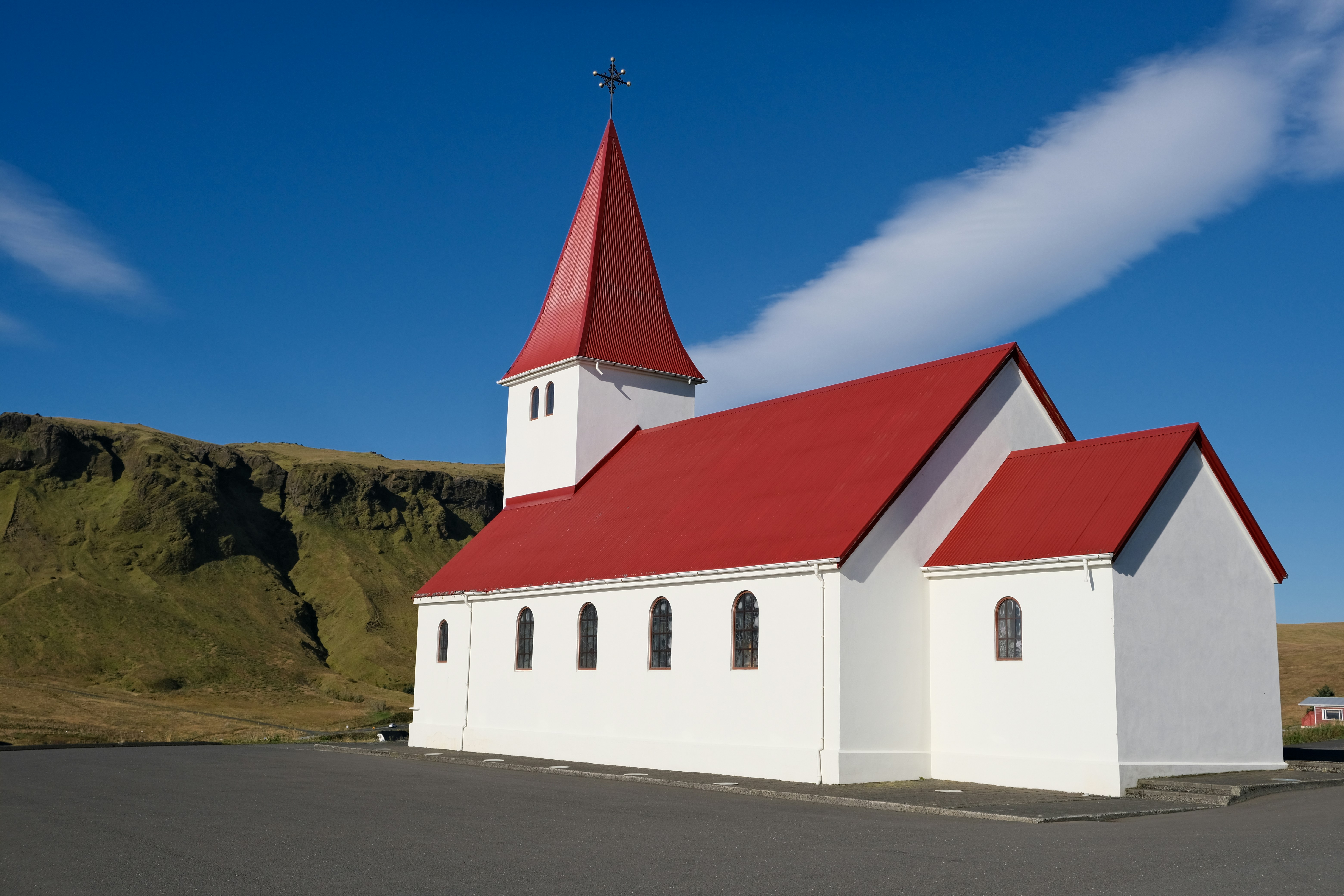 a white building with a red roof