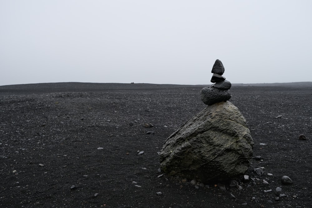 a stack of rocks in a field