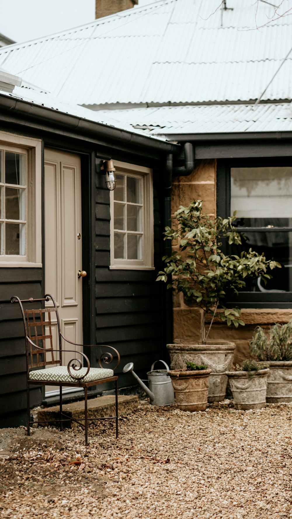 a chair and a table outside a house