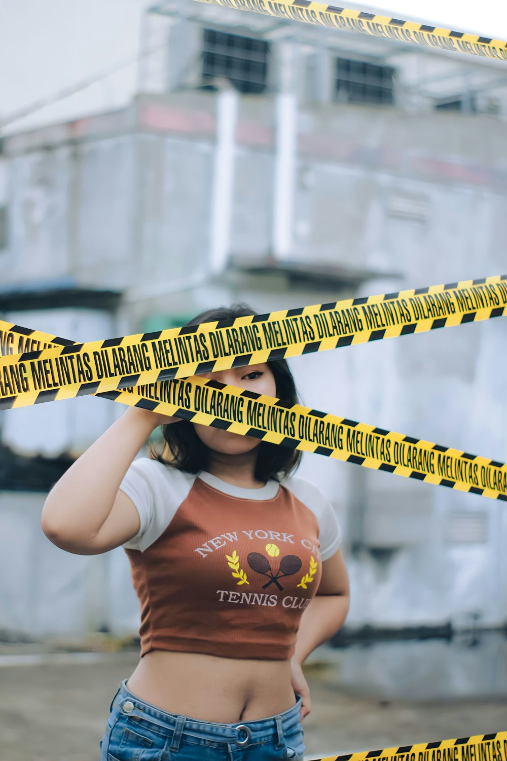 a person holding a yellow tape measure