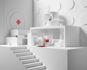 a white room with a white staircase
